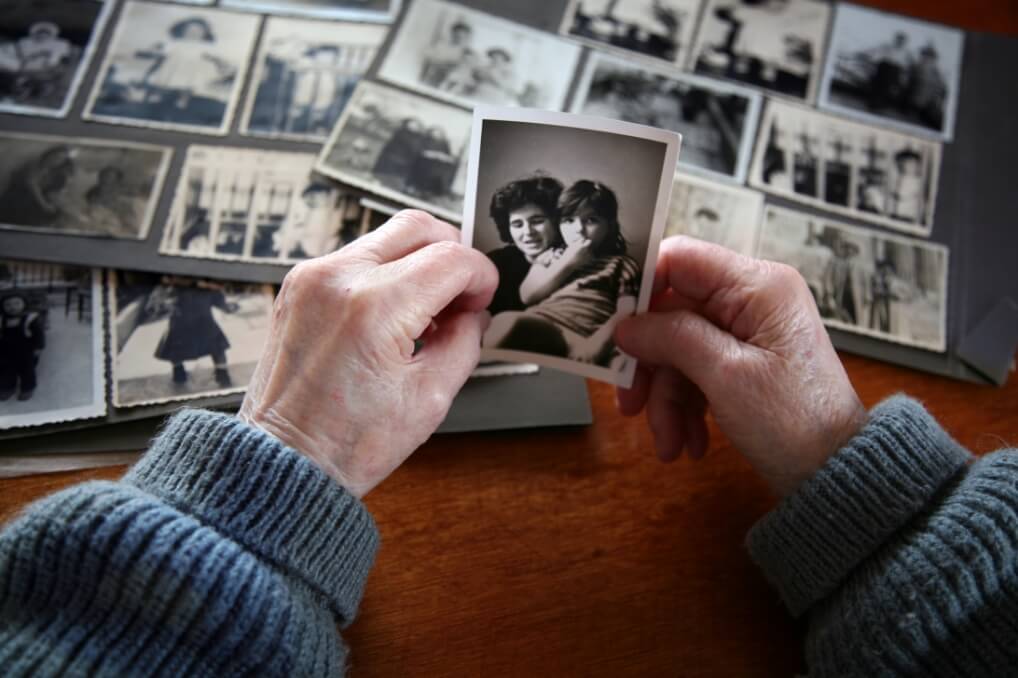 Black and white printed picture of a young girl and her mother