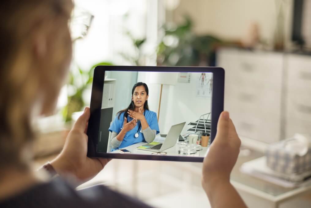 Woman on a video call with her doctor